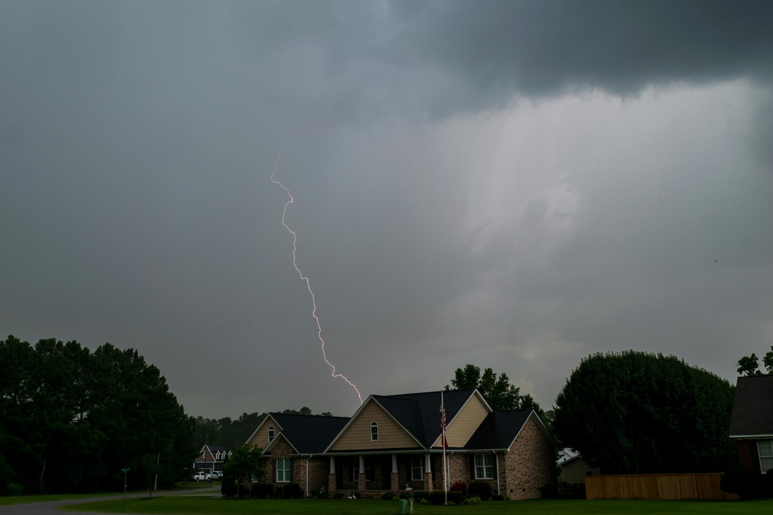 Stormcloud and lightning over a house