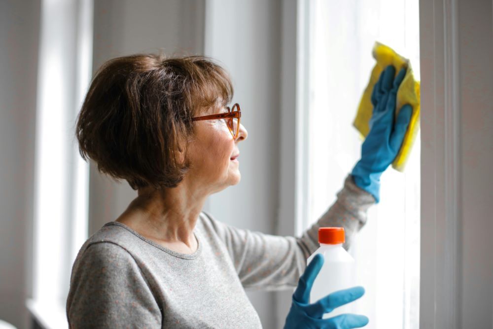 A woman cleaning the window