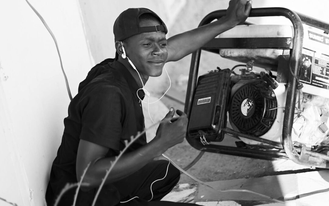 Man fixing his generator